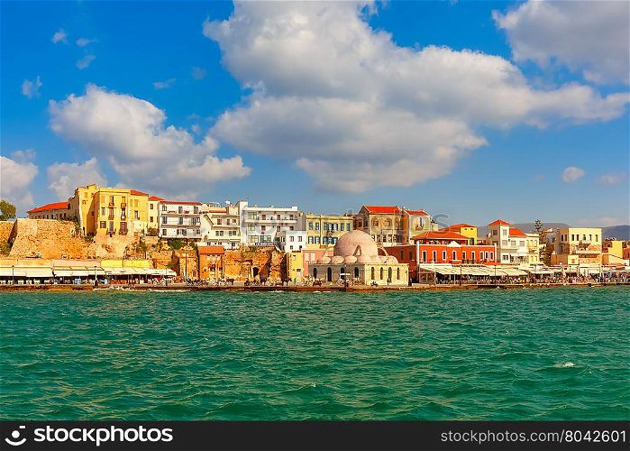 Old harbour of Chania with Venetian quay and Kucuk Hasan Pasha Mosque in the sunny morning, Crete, Greece