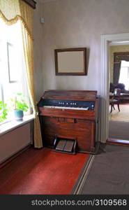 old harpsichord near light window