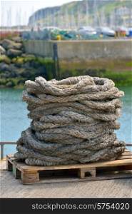Old hawser rope in harbor