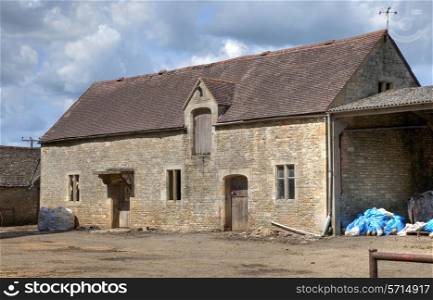 Old, high-status farm barn, Cotswolds, Gloucestershire, England.