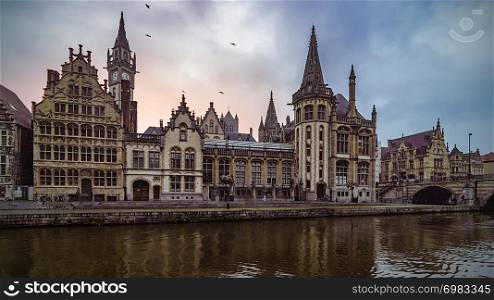 old historic buildings along the river in the city of ghent, belgium