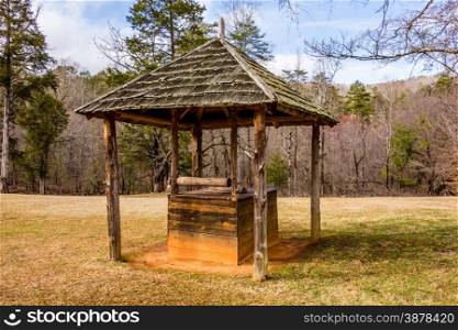 old historic water well in the forest