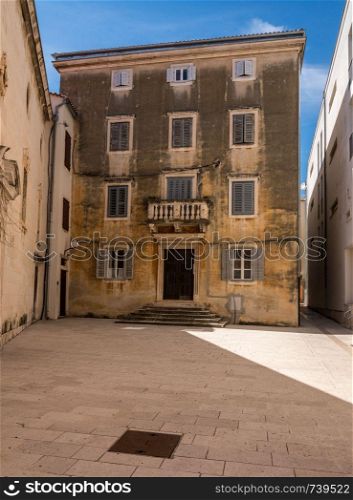 Old home in the ancient old town of Zadar in Croatia. Old building in the old town of Zadar in Croatia
