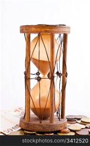 Old hourglass (made in India, XIX century) with euros