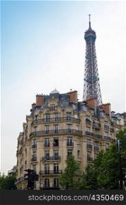 Old house and kind on Eiffel tower. Paris.