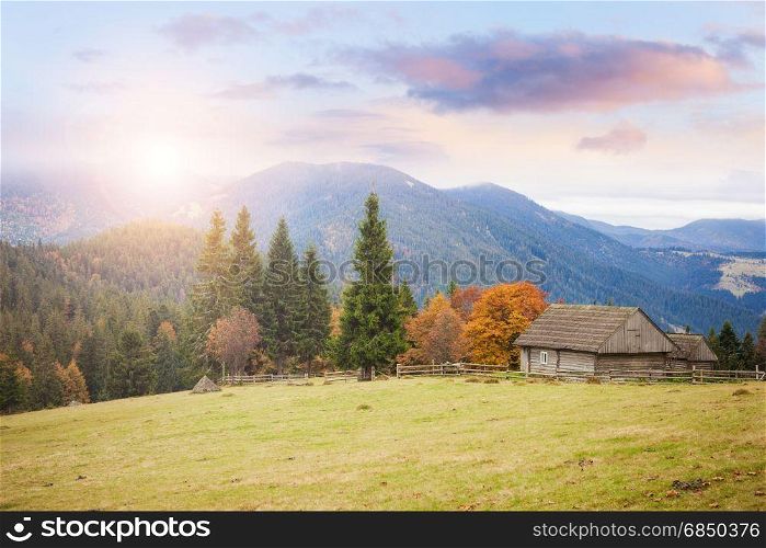 Old house at the mountain hill. Countryside farmland alpine landscape