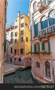 Old house on a canal in Venice, Italy
