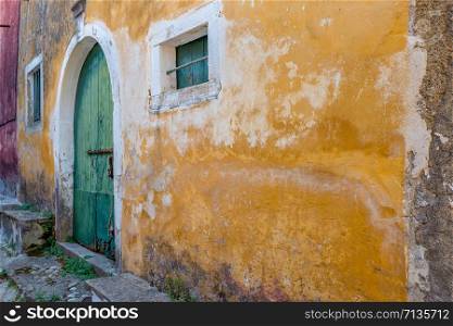 Old house with a plastered wall in Sinarades on Corfu.