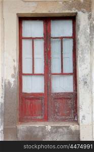 Old house with a red door weathered wood&#xA;