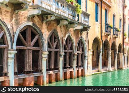 Old house with arches and balcony near canal in Venice. Old house with arches and balcony in Venice