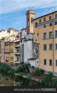 Old houses along the bank of the Arno River in Florence, Italy