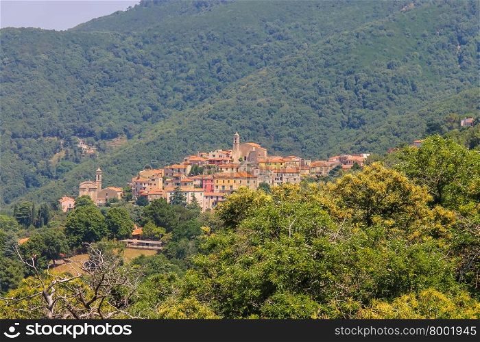 Old houses and bell towers on the hill on Elba Island, Marciana, Italy