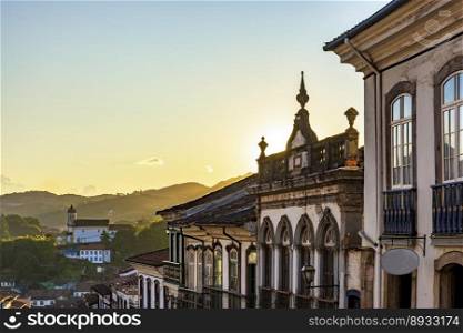 Old houses and church on the hills of the historic city of Ouro Preto in Minas Gerais. Old houses and church on the hills in  Ouro Preto