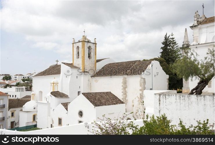 Old houses and churchn in the algarve area of Portugal