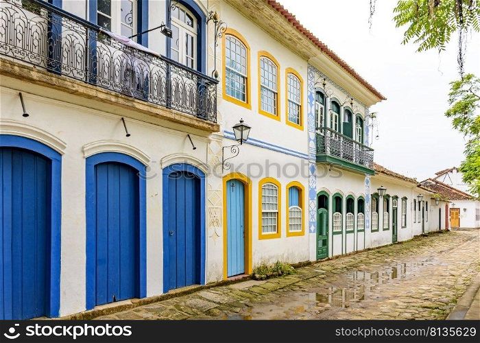 Old houses facades in colonial style on the streets of the old and historic city of Paraty founded in the 17th century on the coast of the state of Rio de Janeiro, Brazil. Old houses facades in colonial style on the old and historic city of Paraty