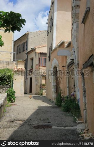 Old houses in a street in the Provence, France