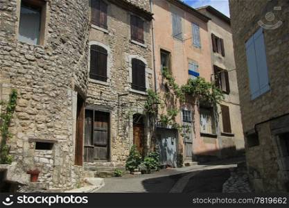 Old houses in a street in the Provence, France