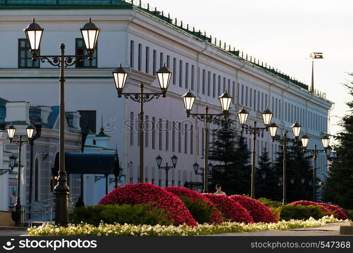 Old iron street lamps on a small street.. Old iron street lamps on a small street