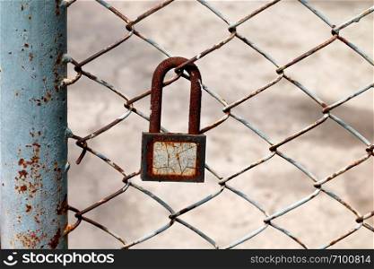 old key lock on the metal fence