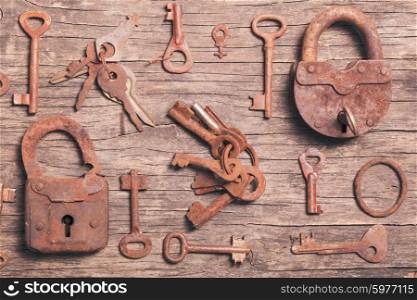 old keys locks over vintage wooden table. old keys