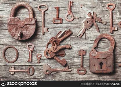 old keys locks over vintage wooden table. The old keys