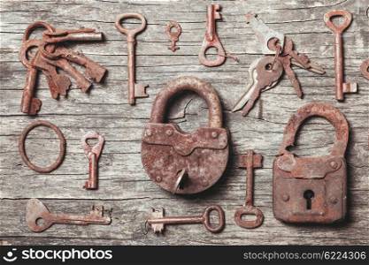 old keys locks over vintage wooden table. The old keys