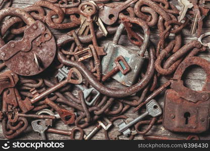 old keys locks over vintage wooden table. The old keys