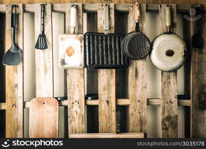 Old kitchen utensils of various kinds. Vintage color filtered.