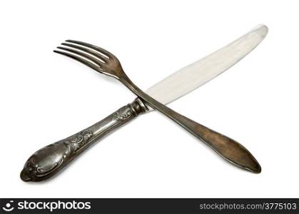 Old knife and fork on a white background