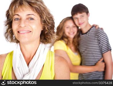 Old lady in focus while mother hugs her son in the background isloated on white.