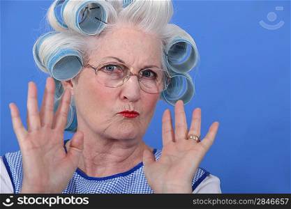 Old lady wearing hair rollers