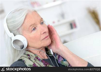 Old lady with headphones on