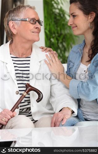 Old lady with young carer