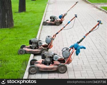 Old lawnmowers on the street in the city