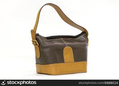 Old leather brown lady&rsquo;s handbag isolated on white background