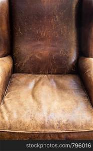 Old leather chair close-up, brown texture retro design. Old leather chair close-up, brown texture, retro design
