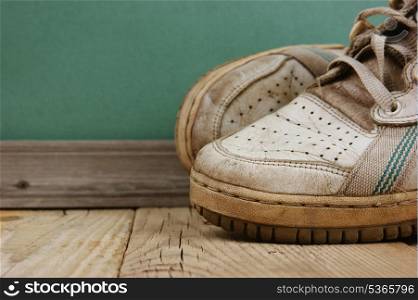 old leather shoes on a wooden floor
