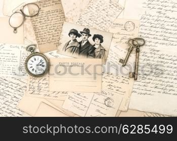 old letters and postcards, antique accessories and photo. nostalgic sentimental background. ephemera