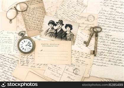 old letters and postcards, antique accessories and photo. nostalgic sentimental background. ephemera