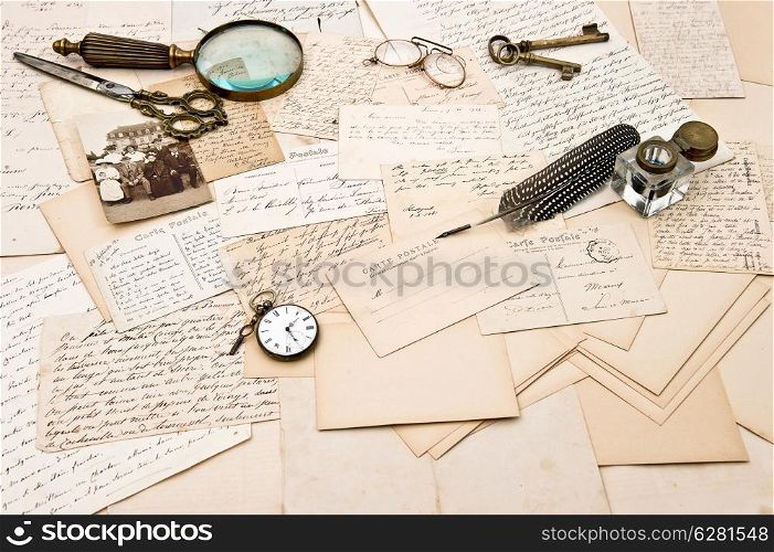 old letters, postcards, vintage accessory and photo of a family. retro style nostalgic background. collectible goods. ephemera