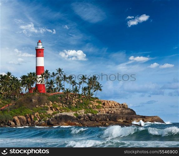 Old lighthouse and waves of sea. Kovalam (Vizhinjam) Kerala, India