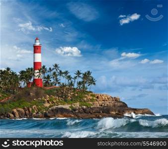 Old lighthouse and waves of sea. Kovalam (Vizhinjam) Kerala, India