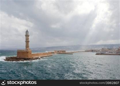 Old lighthouse in Chania in stormy weather.. Lighthouse in Chania. Greece.