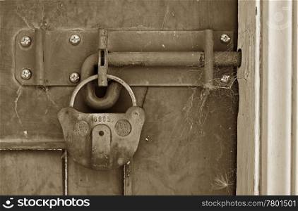 old locked door. big old lock keeps this door shut