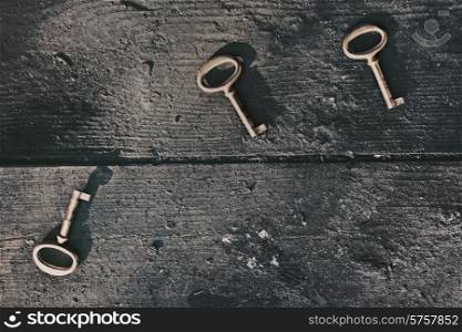 Old lost keys on floorboards closeup