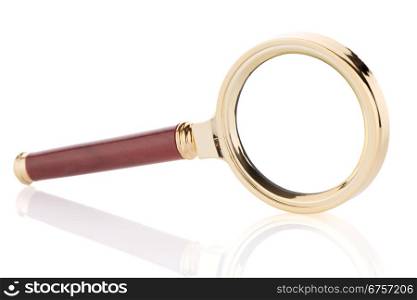 Old magnifying glass isolated over white background.