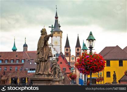 Old Main Bridge over the Main river and scenic towers in the Old Town of Wurzburg view, Bavaria region of Germany