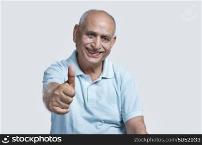 Old man giving thumbs up