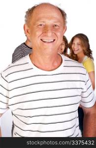 Old man in focus with family in the background, isolated over white..