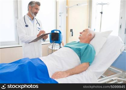 old man in hospital bed